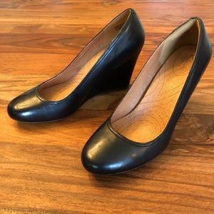 Black leather closed toed wedges